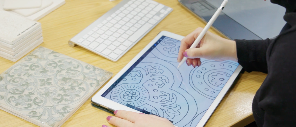 Designer Mel designing on an iPad