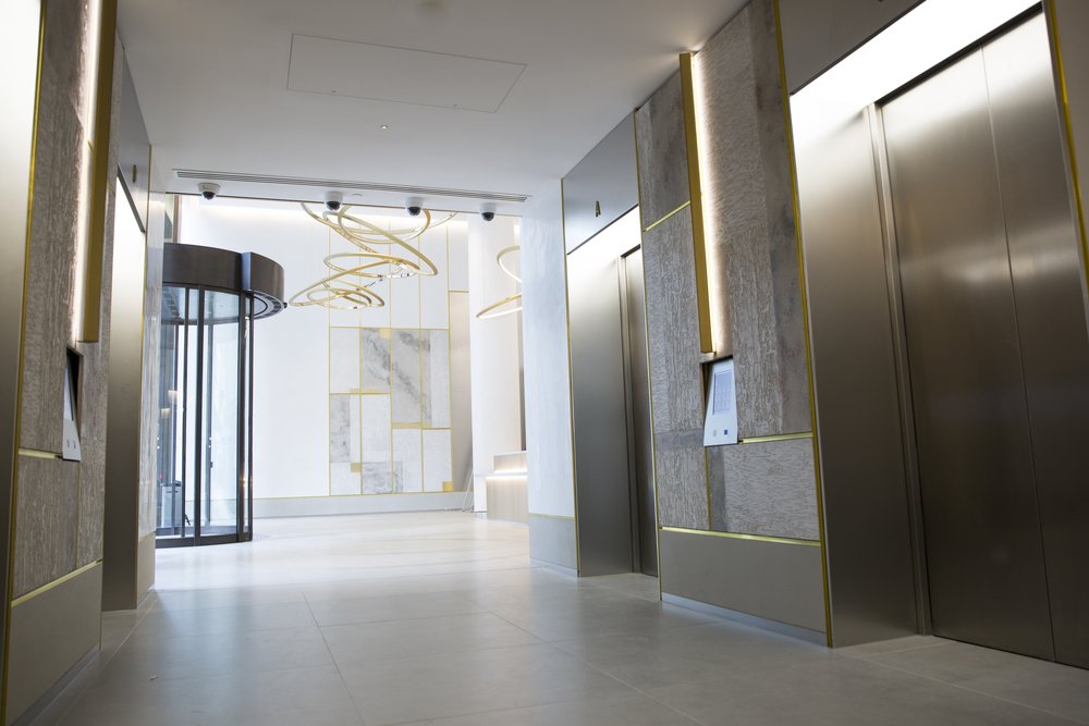 Image showing three square panels, one gold, one bronze and one charcoal, with etched out patterned detailing.